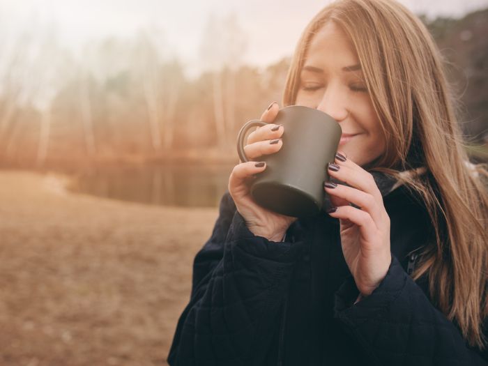 Woman enjoying tea in winter